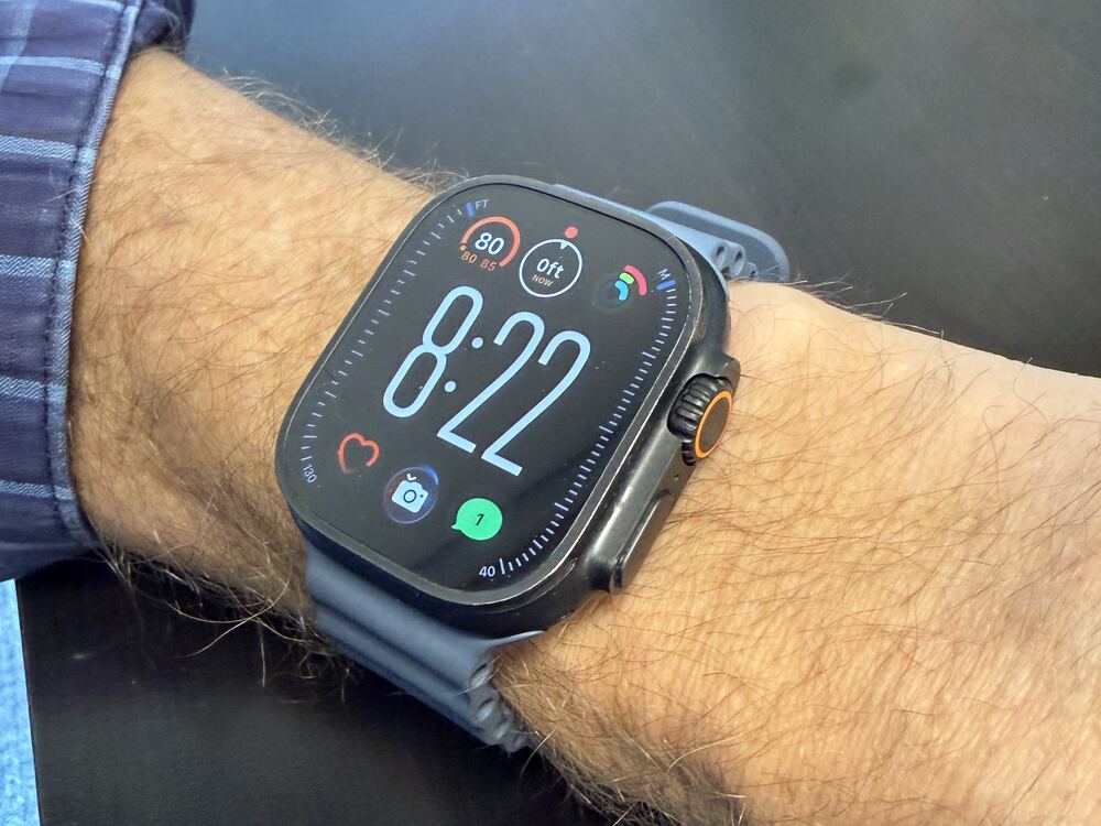 Apple Watch Ultra 3 on Joe's wrist showing heart rate and activity rings